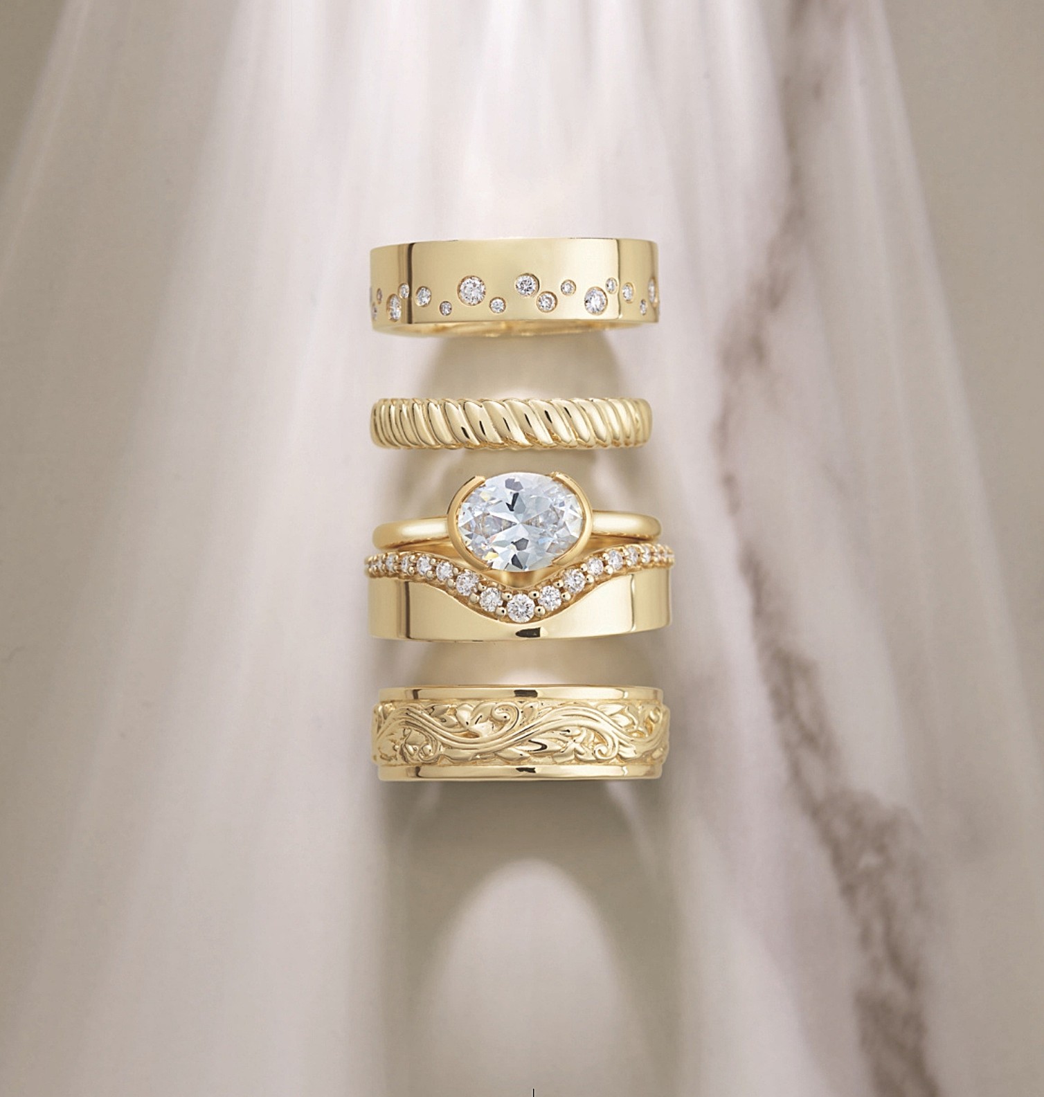 Custom wedding band modeled against an existing engagement ring